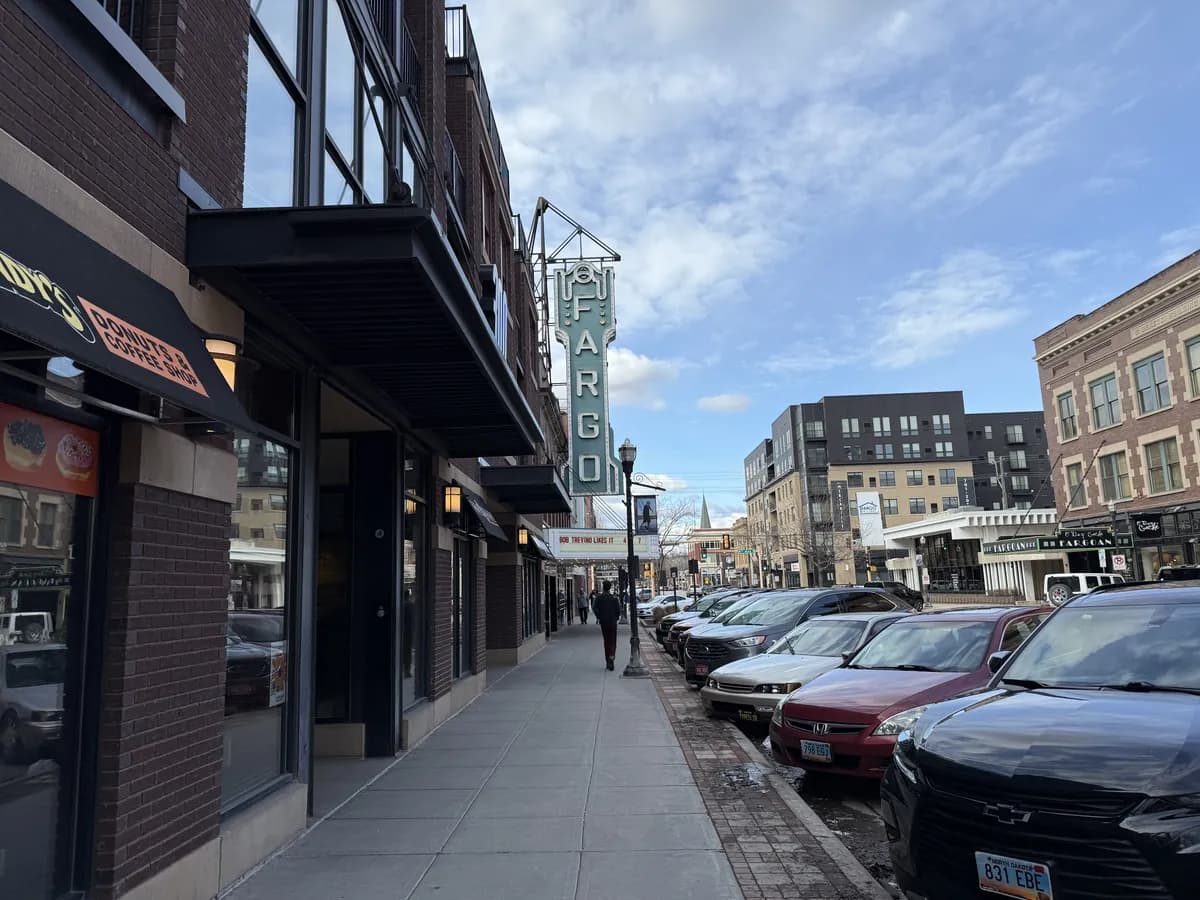 Storefronts along Broadway in downtown Fargo on a grey afternoon